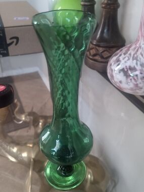 Vintage Hand-blown emerald green glass bud vase with a bulbous base.